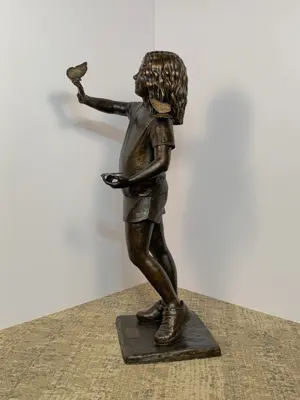 Girl with a butterfly — side view; sculpture by Lindsay Lacroix Peichl